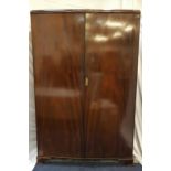 MAHOGANY TWO DOOR WARDROBE with an internal door mounted mirror, shelf and hanging rail, standing on