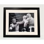 SUGAR RAY LEONARD SIGNED PHOTO in black and white, fighting and eventually beating Marvin Hagler,