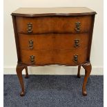 WALNUT SERPENTINE CHEST with a moulded top above three drawers, standing on cabriole supports, 71.