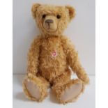 STEIFF TEDDY BEAR in blond mohair, limited edition number 00619, with chest tag, button to ear and