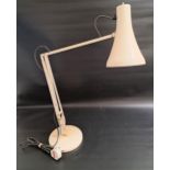 ANGLEPOISE ADJUSTABLE LAMP raised on a circular weighted base and finished in off white