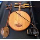 SELECTION OF MUSICAL INSTRUMENTS comprising a Chinese yueqin moon lute, Chinese erhu and a Thai