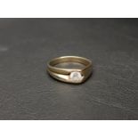 UNUSUAL FOURTEEN CARART GOLD RING the half concave design set with a CZ stone at its apex,