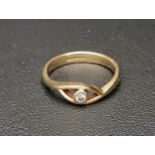 DIAMOND SINGLE STONE RING the bezel set diamond approximately 0.06cts, on nine carat gold shank with