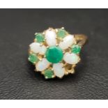PRETTY EMERALD AND OPAL CLUSTER DRESS RING on nine carat gold shank, ring size K