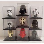 NINE STAR WARS MINIATURE HELMETS including Darth Vader, C-3PO, Storm Trooper, Scout Trooper, At-At