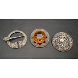 THREE SCOTTISH SILVER BROOCHES comprising a penannular brooch with Celtic entwined detail; a