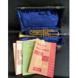 B & M CHAMPION TRUMPET numbered Y8433, in a fitted case with some sheet music