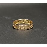 FOURTEEN CARAT GOLD BAND the pierced meander design between two thin textured bands, approximately