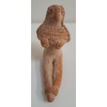 SYRO-HITTIE TERRACOTTA FIGURINE of a female idol of stylized form, with stippled rows to her neck