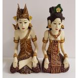 PAIR OF 20th CENTURY CARVED INDONESIAN FIGURES depicting a bride and groom in traditional dress,