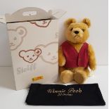 STEIFF WINNIE THE POOH BEAR with pouch and box, with button to ear and red and white tag, 51cm high