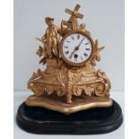 FRENCH GILT METAL MANTLE CLOCK the circular enamel dial with Roman numerals and a 30 hour
