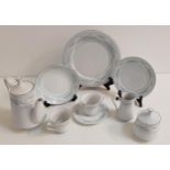 CROWN MING DINNER SERVICE the white ground with a pale blue floral border, for twelve place