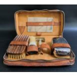 GENTS TRAVELLING LEATHER TOILET BAG with zip closure, opening to reveal a mirror, soap dish,