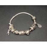 PANDORA MOMENTS SNAKE CHAIN BRACELET with nine charms including Daisy the Rabbit, 21st Celebration