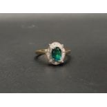 EMERALD DOUBLET AND DIAMOND CLUSTER RING the central oval cut emerald doublet measuring