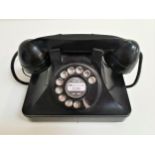 VINTAGE BAKELITE TELEPHONE with a rotary dial and handset, with current socket fixing