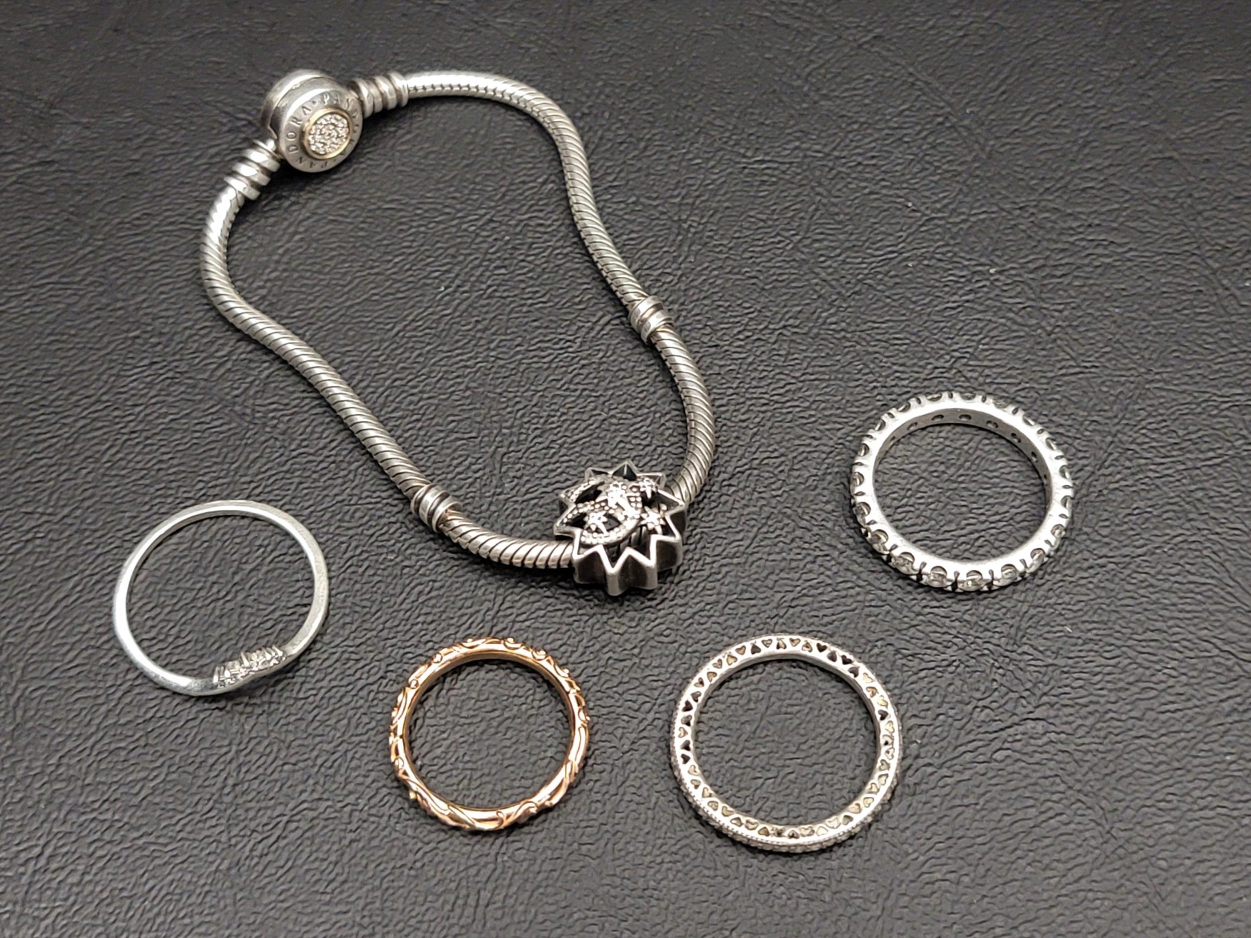 SELECTION OF PANDORA JEWELLERY comprising a Moments Logo Clasp Snake Chain Bracelet with a Disney