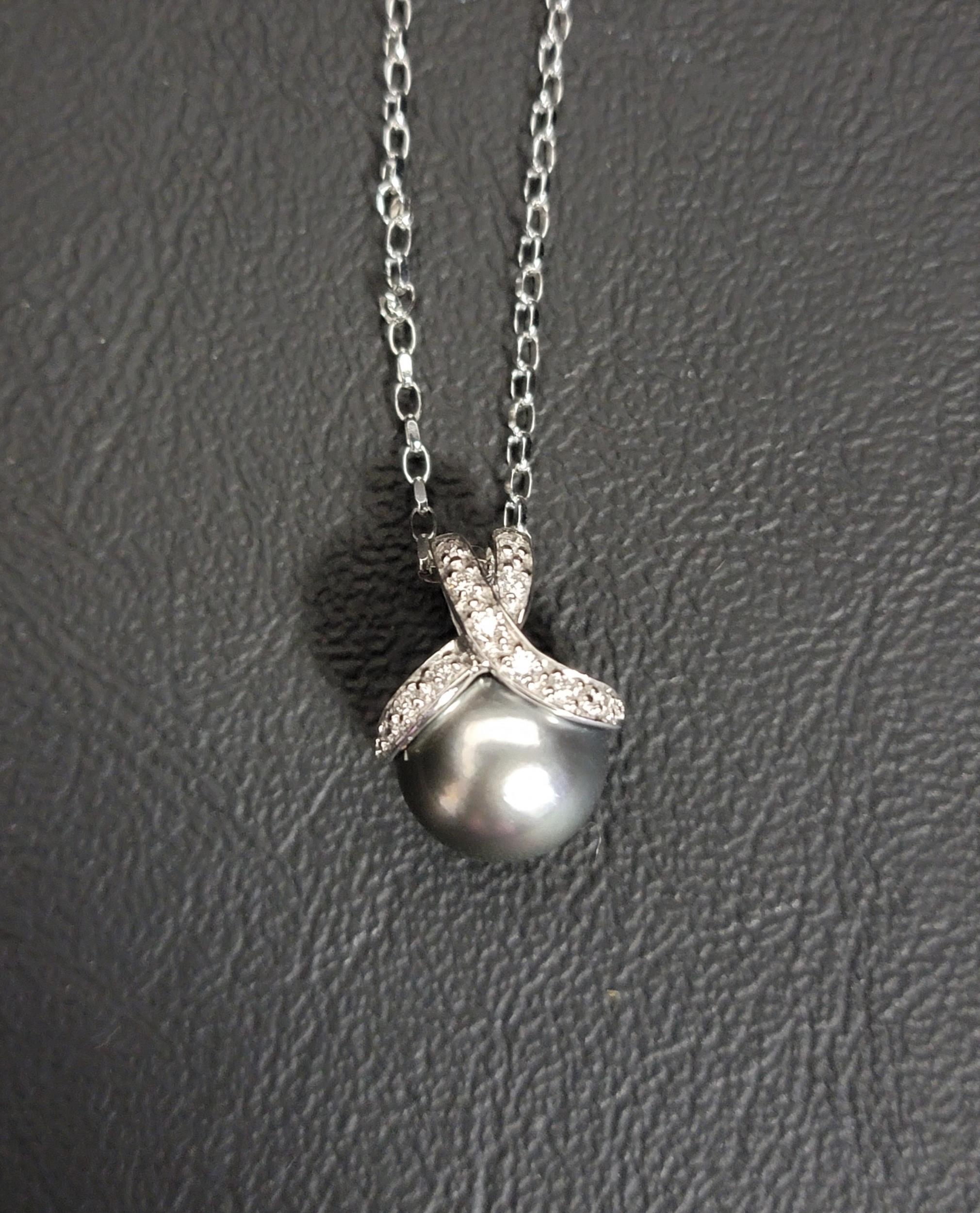 TAHITIAN PEARL AND DIAMOND PENDANT the diamonds set to the decorative crossover suspension loop,