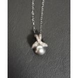 TAHITIAN PEARL AND DIAMOND PENDANT the diamonds set to the decorative crossover suspension loop,