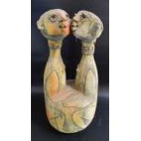 STUDIO POTTERY DOUBLE DECANTER depicting two African women, each with a removeable head, 40cm high