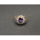 PURPLE AND CLEAR STONE SET RING on eighteen carat gold shank, ring size Q and approximately 3.8