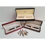 THREE BOXED PENS comprising a Dunhill silver plated fountain pen with fourteen carat gold nib; a Jos