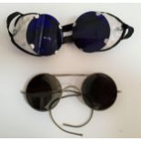 TWO PAIRS OF VINTAGE SUNGLASSES one with metal side guards and blue lenses, the other with brown