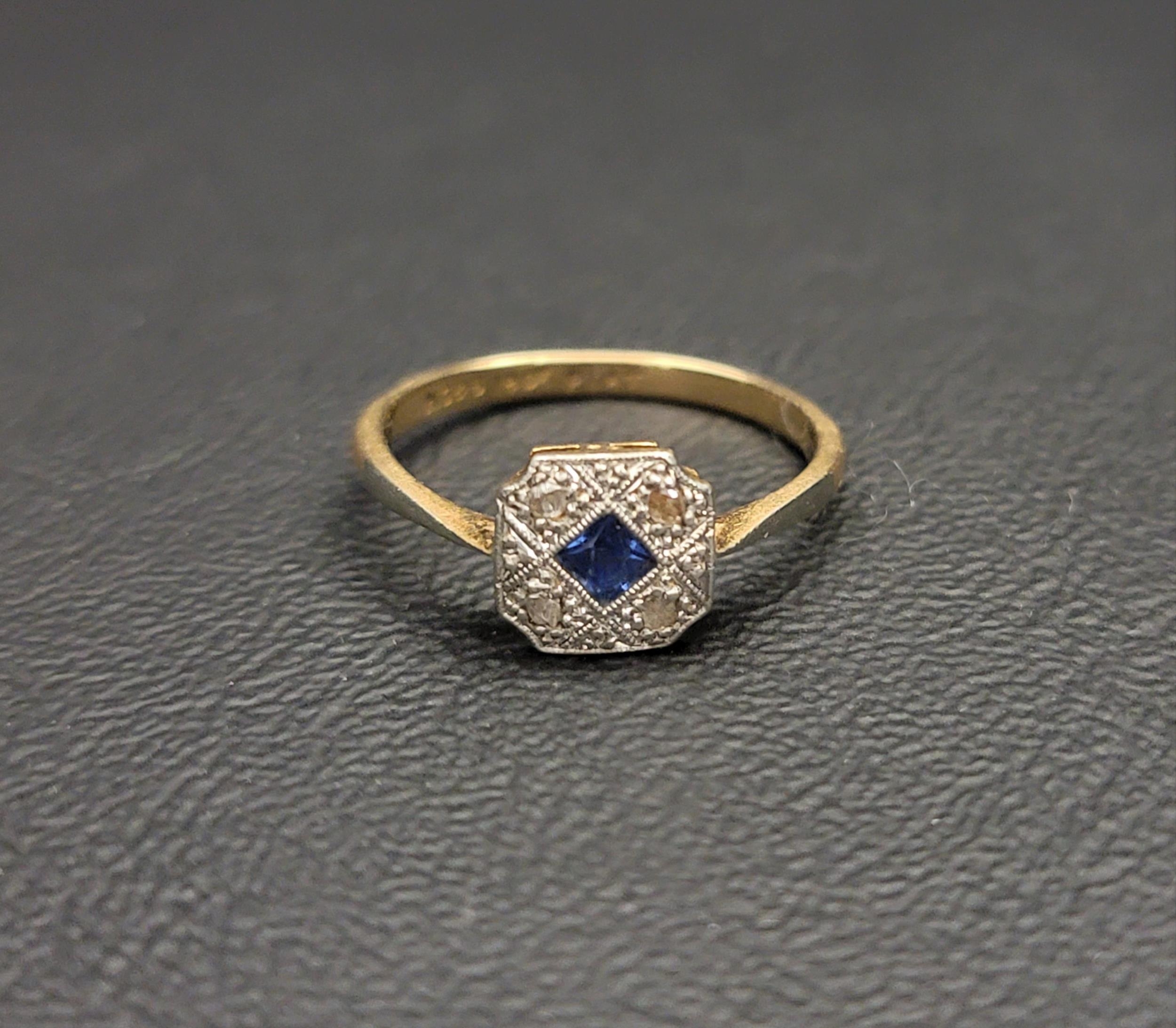 ART DECO SAPPHIRE AND DIAMOND RING in eighteen carat gold and platinum, ring size O