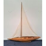 SCALE MODEL OF A SCHOONER the single mast with three sails and rigging, of teak and walnut