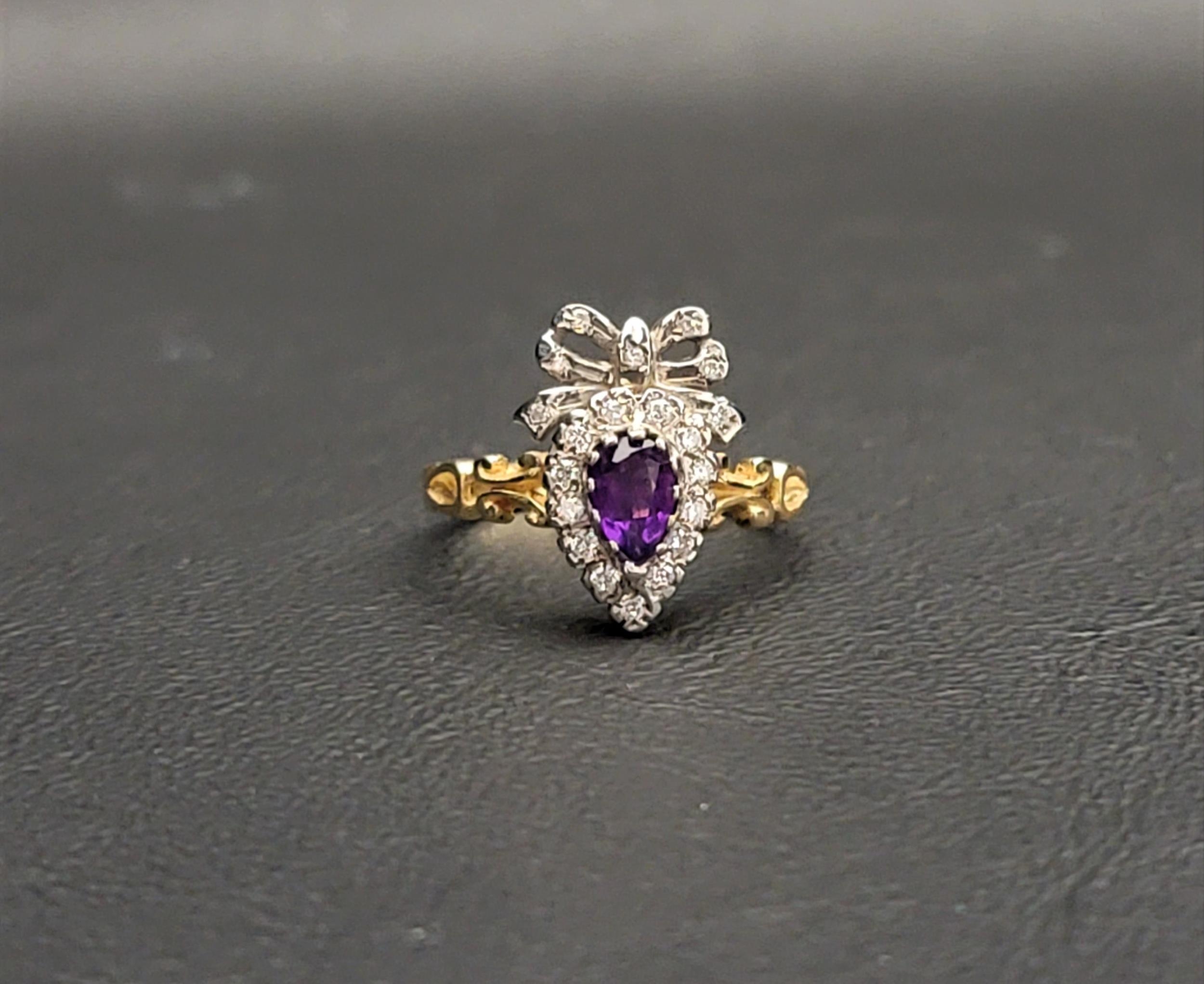 AMETHYST AND DIAMOND CLUSTER RING the pear cut amethyst measuring approximately 0.39 carats