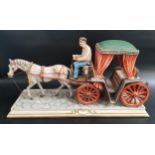 CAPODIMONTE PORCELAIN FIGURE GROUP of a horse and carriage on a cobbled street, 44cm long