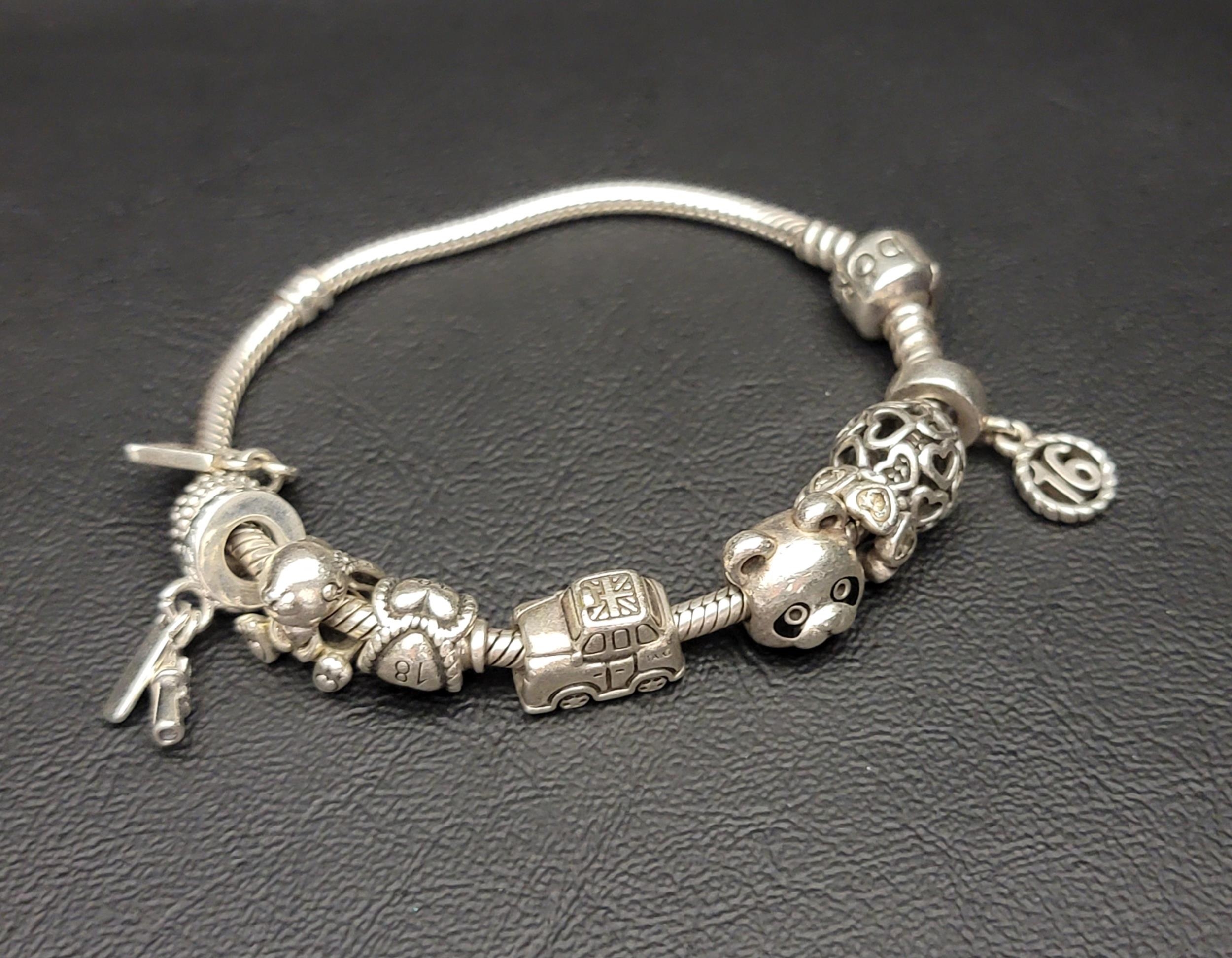 PANDORA MOMENTS SNAKE CHAIN BRACELET with nine charms including Daisy the Rabbit, 21st Celebration - Image 2 of 2