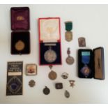 SELECTION OF MEDALS AND BADGES including a Georges Leygues Naval insignia badge, a 'Glory to our