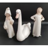 THREE LLADRO FIGURINES comprising Graceful swan 5230, 21.5cm high, Shepherd girl 4678, 21.5cm high