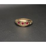 PRETTY RUBY CLUSTER RING the three round cut rubies set in a polished marquise setting with