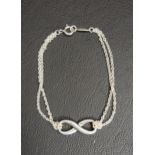 TIFFANY & CO. SILVER INFINITY BRACELET the central infinity symbol flanked by double chain links