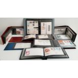 LARGE SELECTION OF FIRST DAY COVERS including one coin example, contained in eight albums