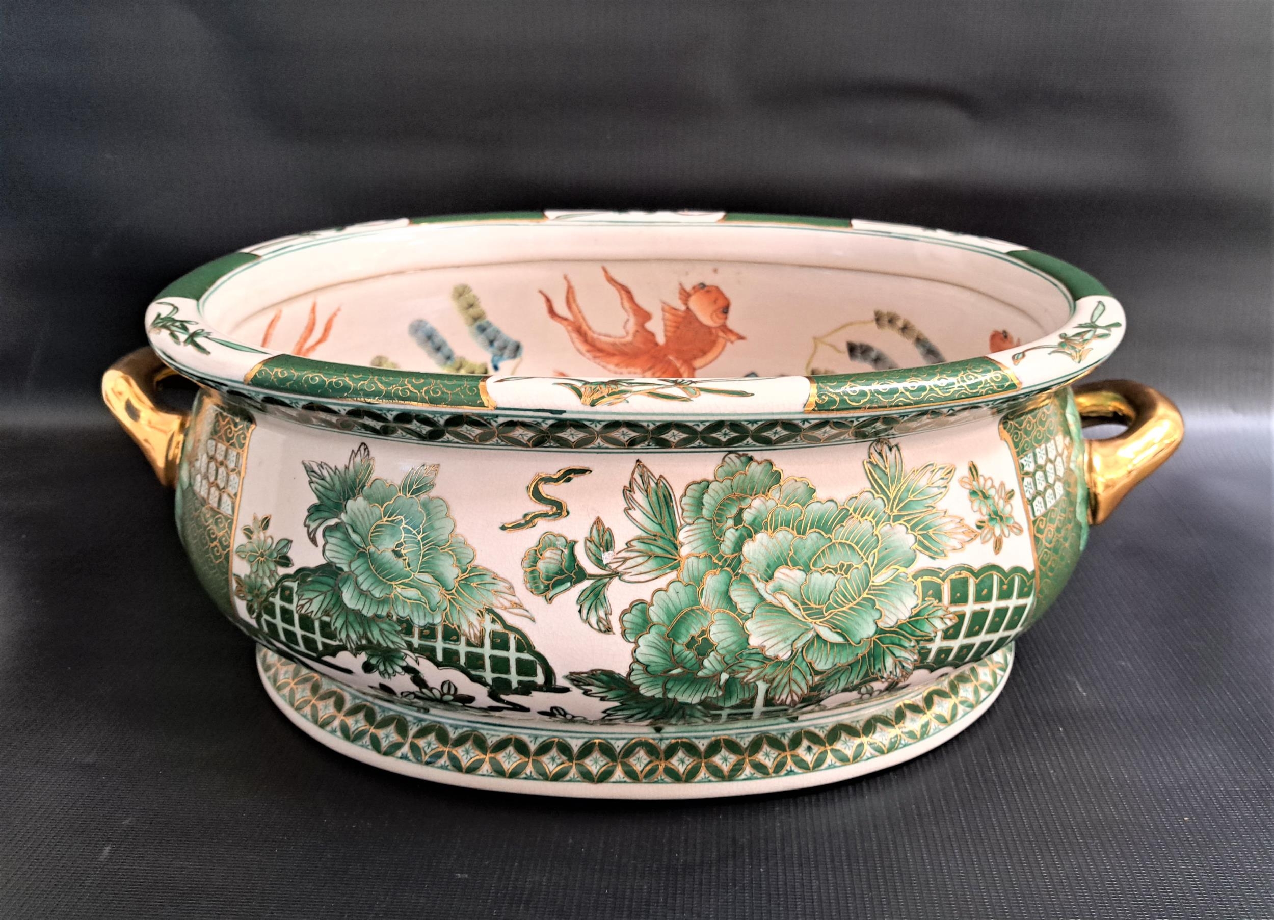 CHINESE FAMILLE VERT FOOT BATH with parcel gilt handles, the interior decorated with koi carp, the