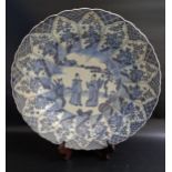 19th CENTURY CHINESE BLUE AND WHITE CHARGER decorated with five figures in a garden, the border with