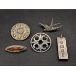 FOUR SILVER BROOCHES AND A PENDANT the brooches comprising one by Charles Horner with central