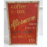 METAL ADVERTISING SIGN with a red ground, 'May 1st Afternoon Teas', on an A frame stand, 71.5cm x