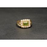 PERIDOT AND PEARL CLUSTER RING the central horizontally set rectangular cut peridot in a fourteen