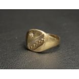 NINE CARAT GOLD SIGNET RING the circular square head set with a round cut diamond opposite