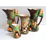 FOUR PIECES OF HORNSEA POTTERY all of tree trunk form with applied deer and squirrels, comprising