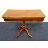 19th CENTURY MAHOGANY TEA TABLE with a shaped fold over rotating top on a turned column with four