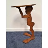 VICTORIAN OAK FIGURAL DUMB WAITER in the form of a boy holding an oval tray aloft, 76cm high