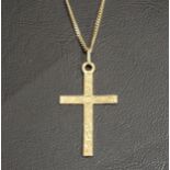 NINE CARAT GOLD CROSS PENDANT the cross with decorative engraving on a nine carat gold chain,