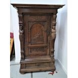 19th CENTURY FLEMISH CARVED OAK HALL CUPBOARD with a carved panel door depicting a mother and